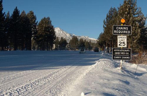 Snow Packed Road with Speed Limit Sign